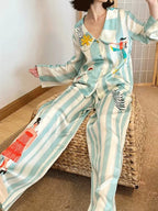 Homewear - Pyjamaset van ijszijde met lange mouwen en print